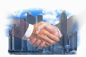 kézfogás a modern városépület pénzügyi negyedében.